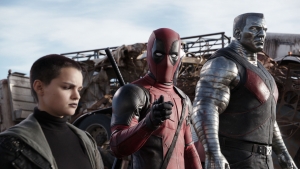 Deadpool (Ryan Reynolds) pauses from a life-and-death battle to break the fourth wall, much to the dismay of his comrades Negasonic Teenage Warhead (Brianna Hildebrand) and Colossus (voiced by Stefan Kapicic).